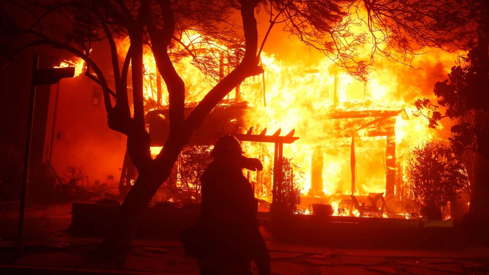 'Tragic time in our history': Two dead in Los Angeles wildfires - as blazes 'growing'