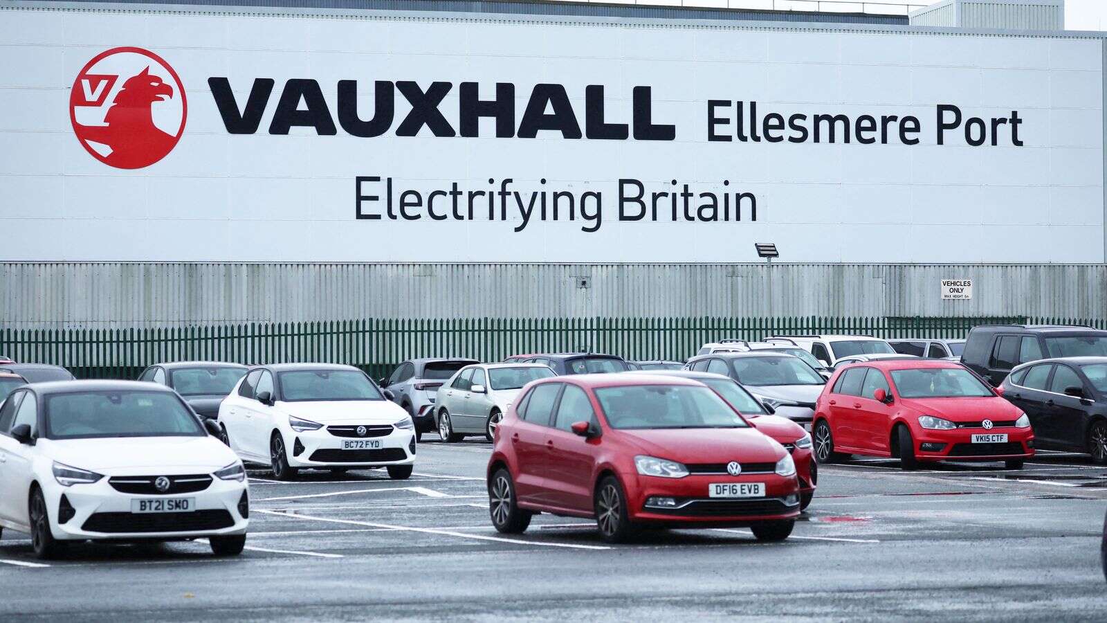 Car maker meets electric vehicle target despite criticising the goal and closing its Luton plant