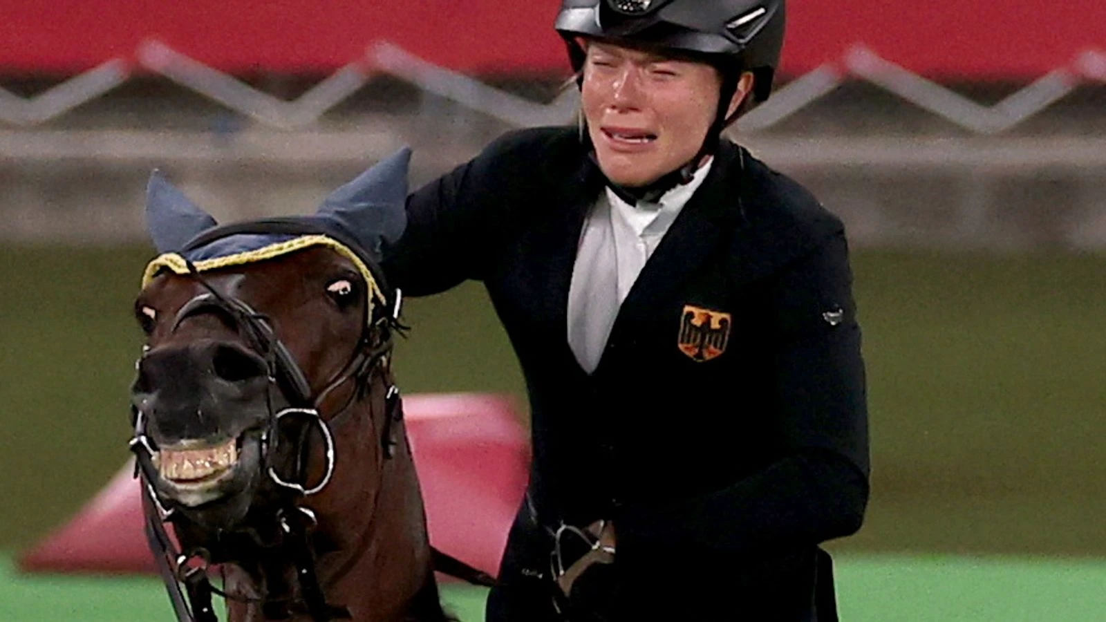 Coach kicked out of Olympics after she punched horse that refused to jump