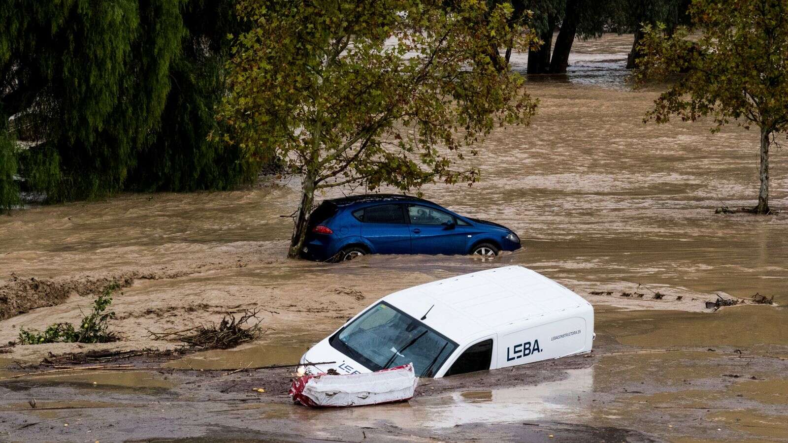 Several missing as flash floods sweep cars through the streets in Spain