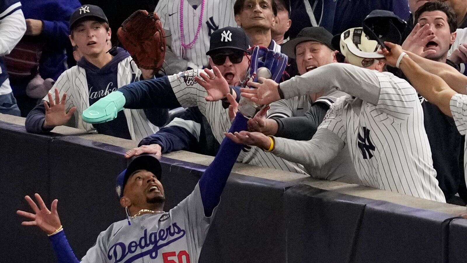 New York Yankees fans who interfered with catch and grabbed player banned from World Series match