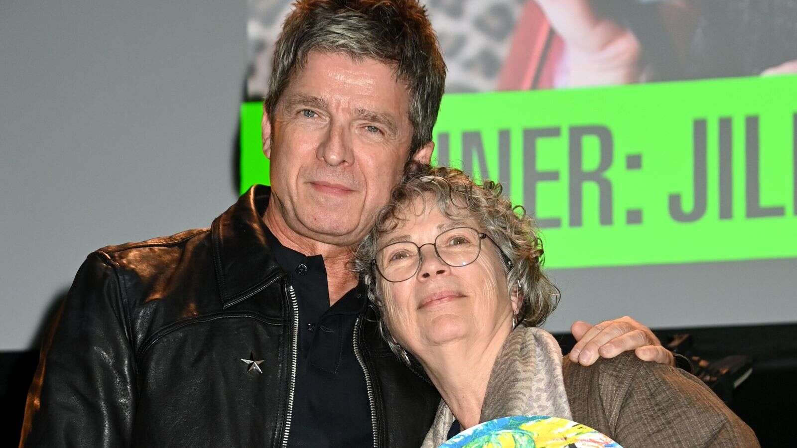 Noel Gallagher surprises 'dear friend' with icon prize at Music Photography Awards