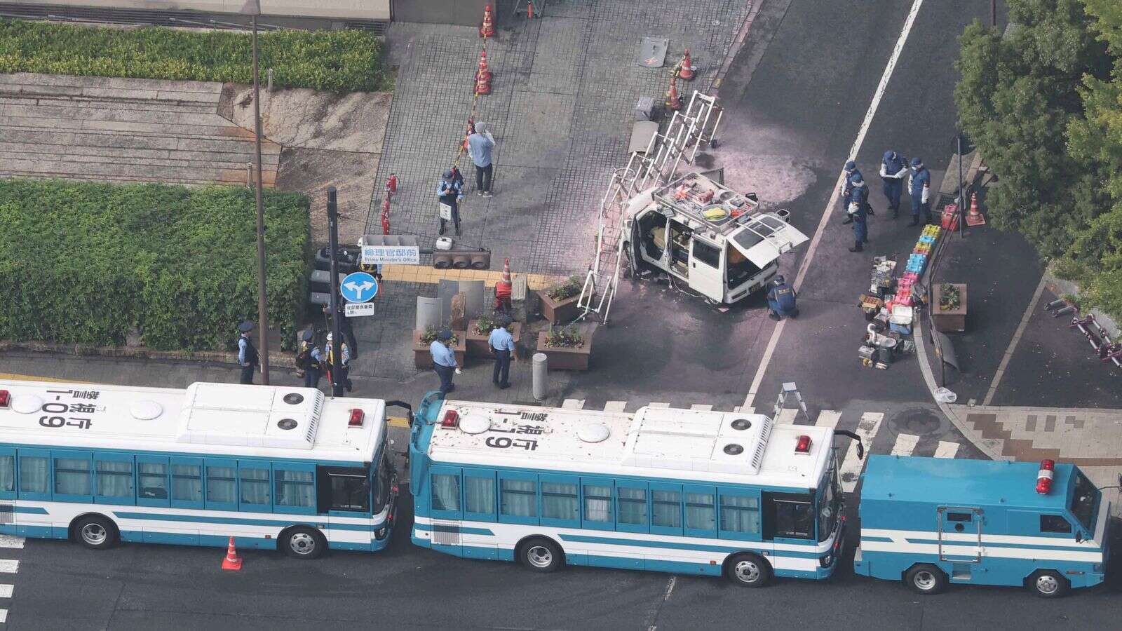 Firebombs thrown at Japan's ruling party HQ and car rammed into security fence around PM's office