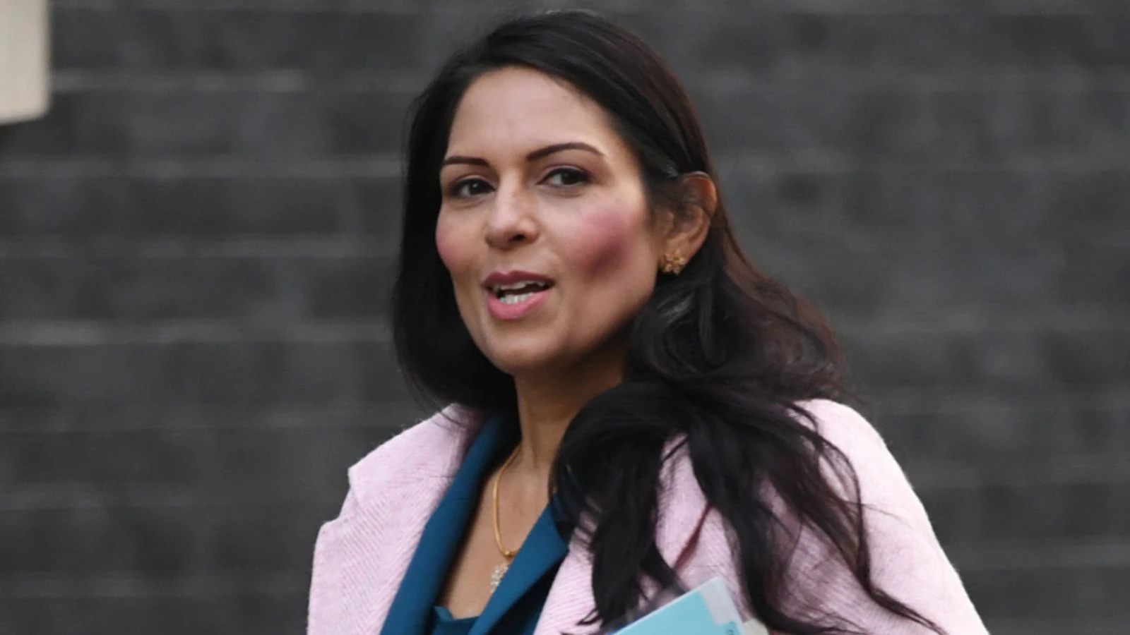 PM says Patel didn't breach ministerial code - but report's author quits after finding she did