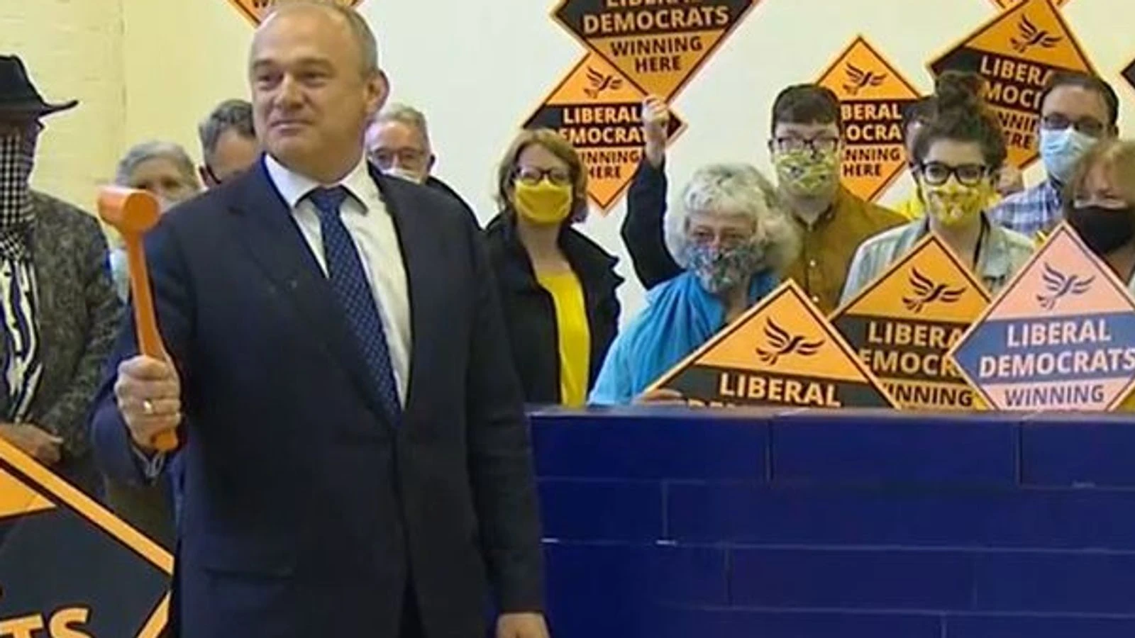 Sir Ed Davey takes down a blue wall... literally