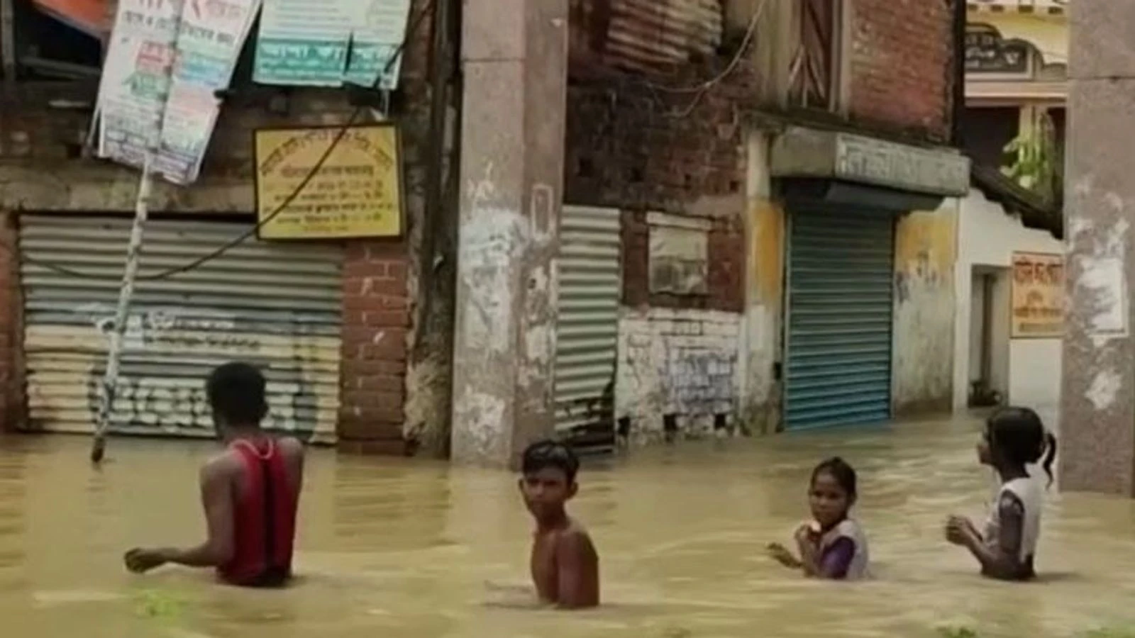 Wading waist-deep in West Bengal floods