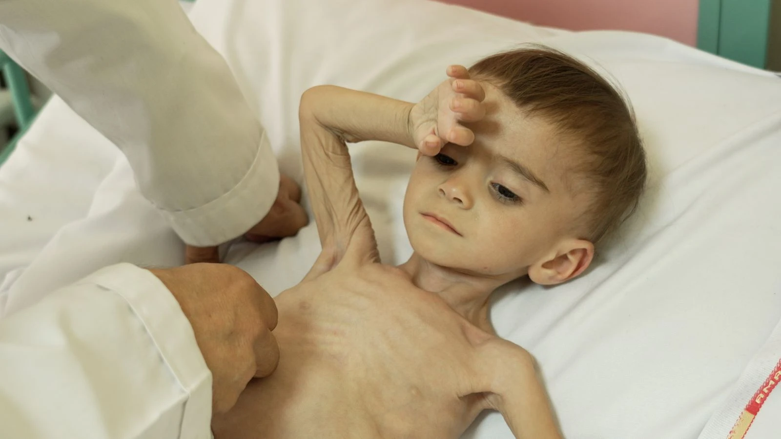 Crying babies dimmed by hunger fill this hospital - where parents fear each day might be the last