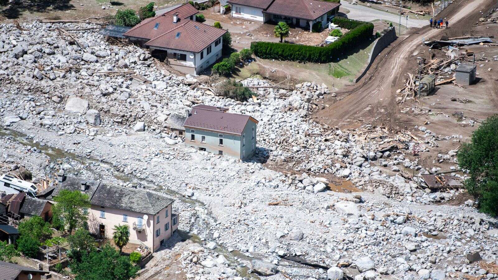 Three people missing after once-in-30-year rains cause floods and landslides in Switzerland