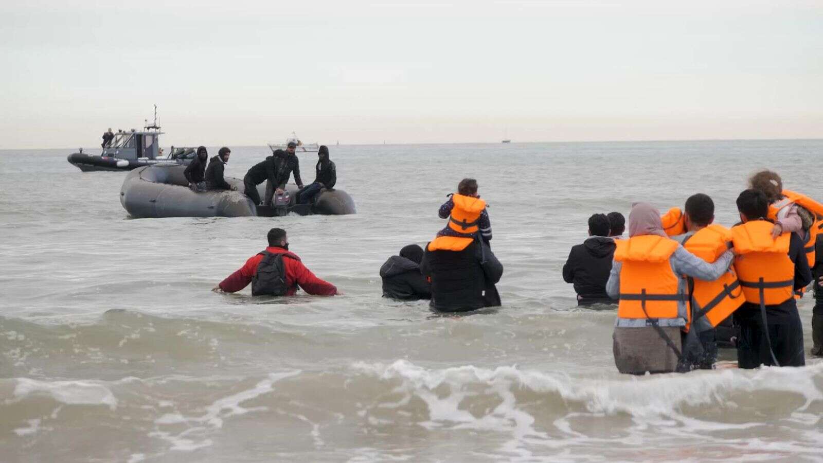 Calm turns to chaos as migrants desperate for Britain board dinghy off French beach