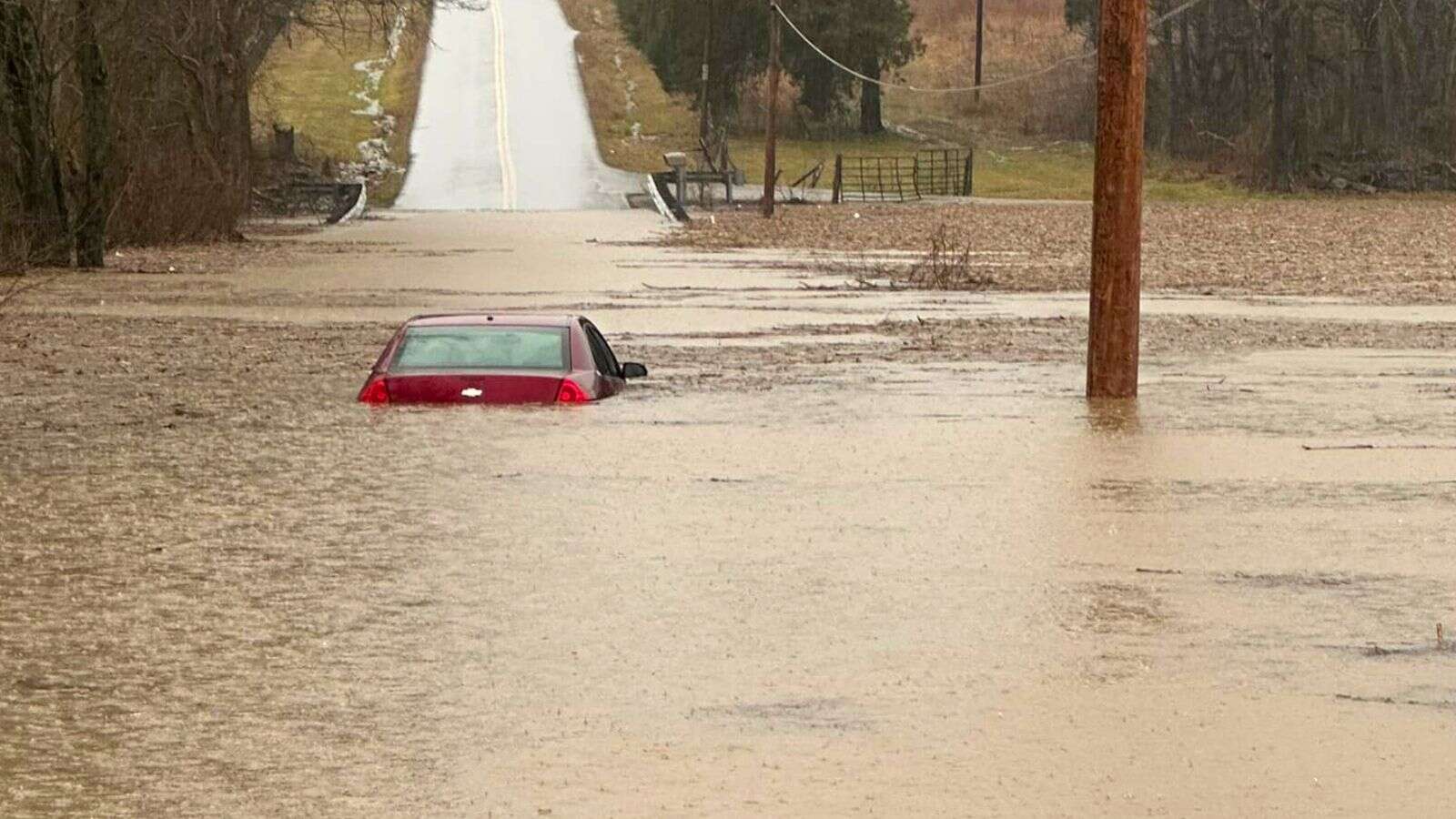 At least nine dead as severe rain, flooding and lows of -35C hit the US