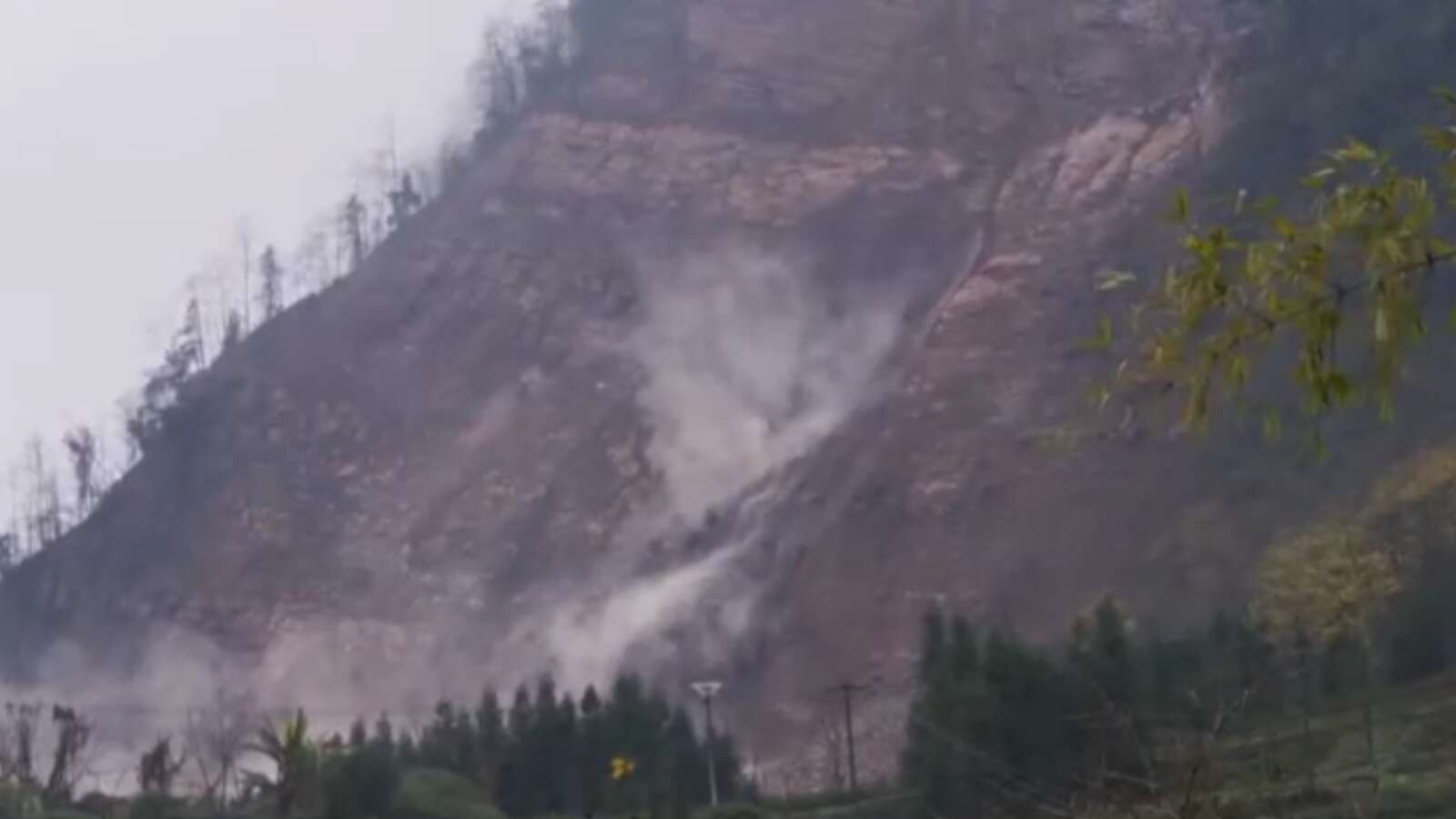 Dozens missing after landslide in China buries 10 houses