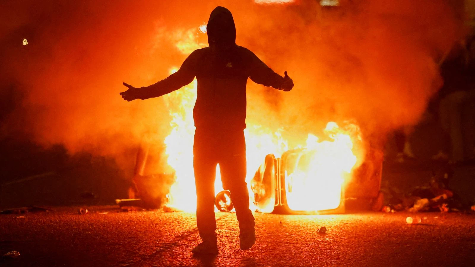 Baton rounds, firebombs and water cannon as families flee 'locals' venting their feelings