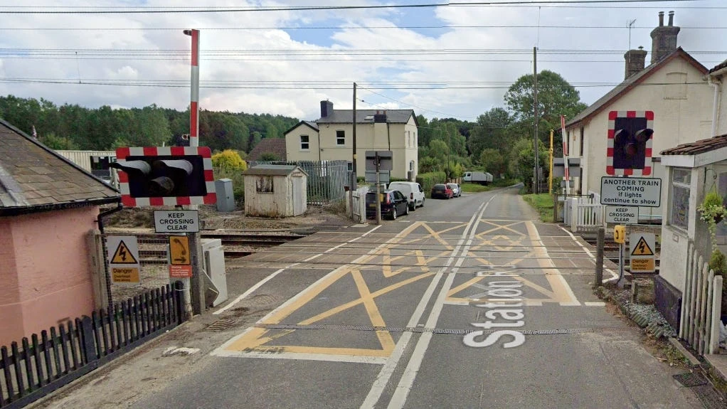Rail lines blocked after train hits car on level crossing