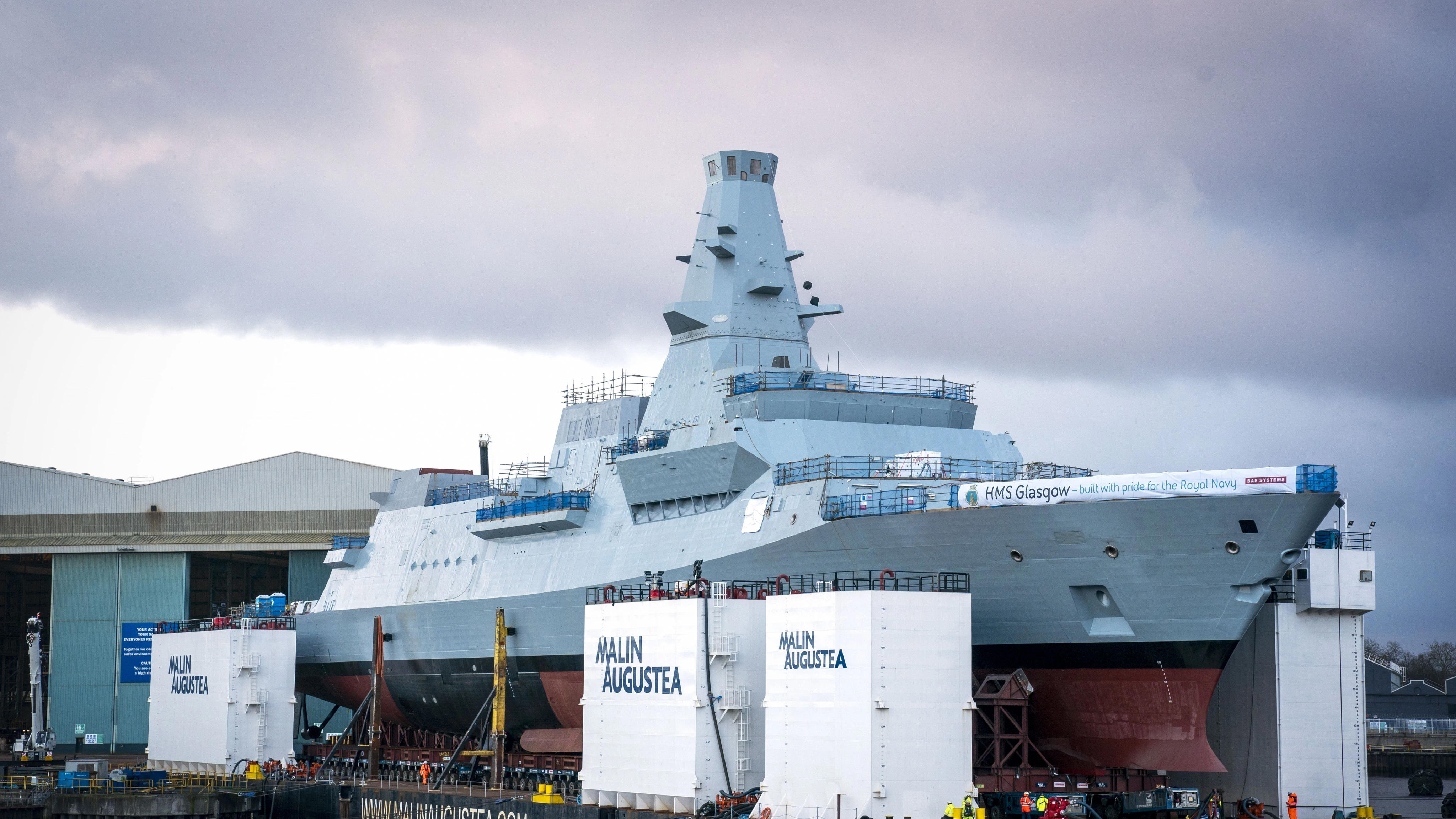 Kate names Royal Navy warship by smashing bottle of whisky against hull