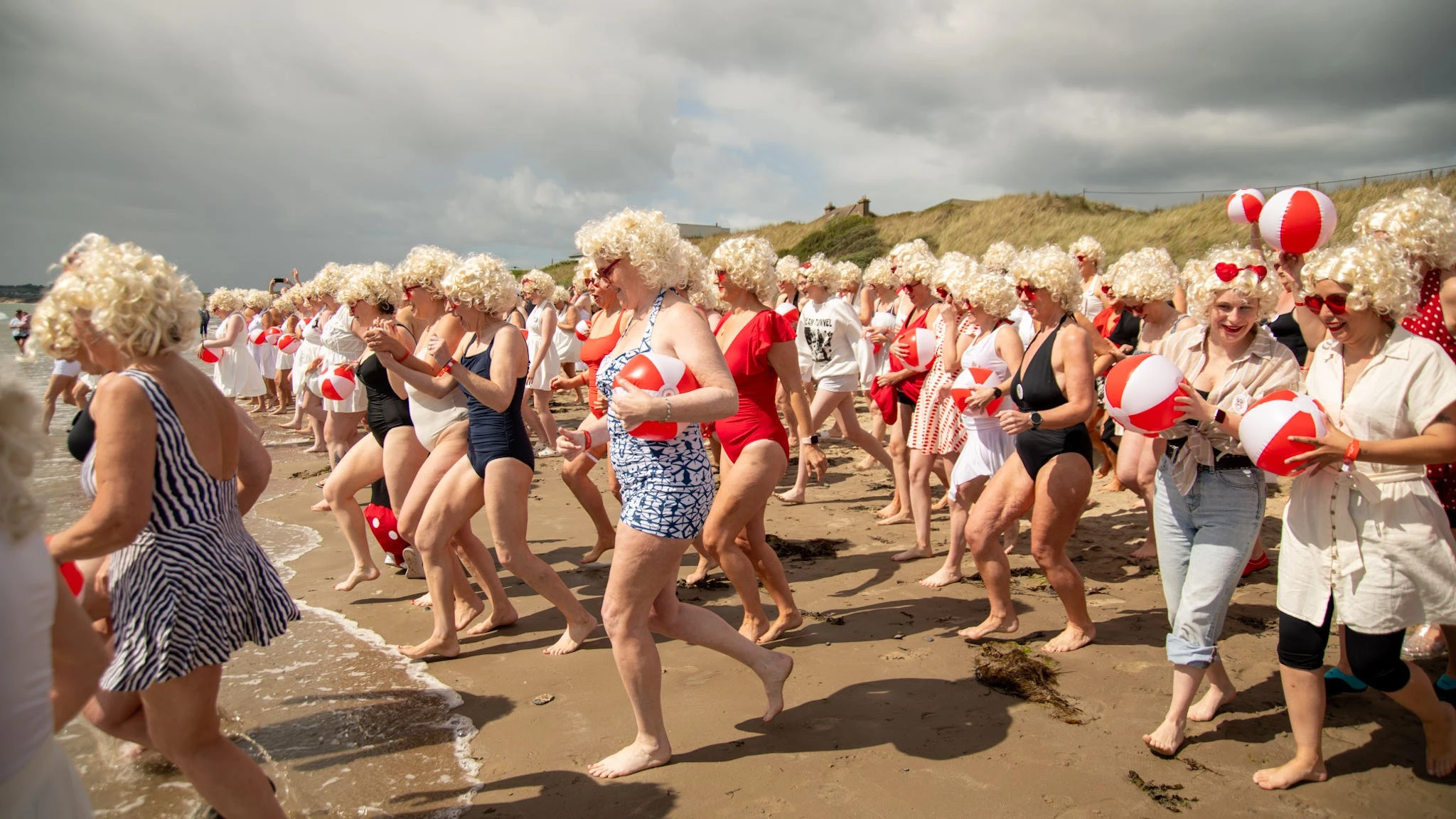 Almost 200 Marilyn Monroe lookalikes take the plunge for charity swim