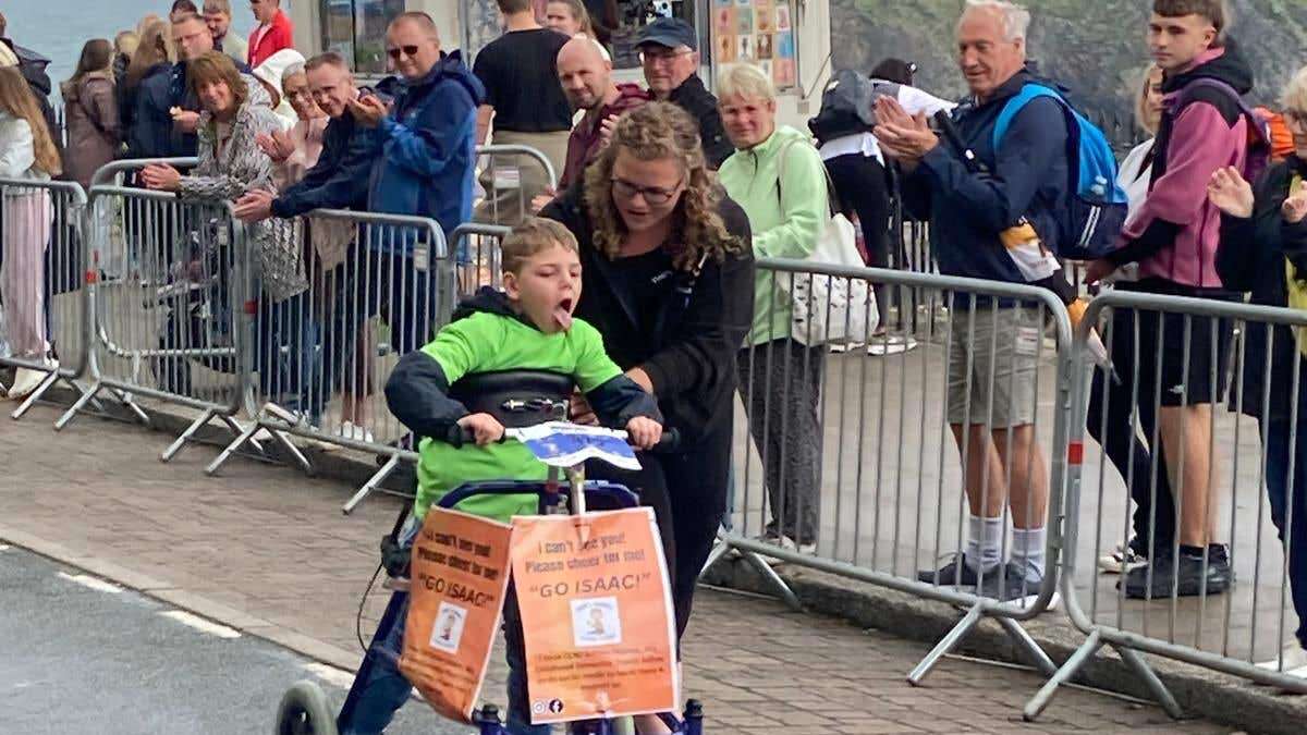 Boy, eight, with rare disease completes Ironkids Wales with walker