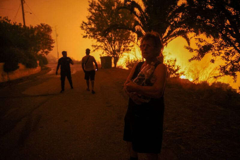 Greece battles wildfires fanned by gale force winds