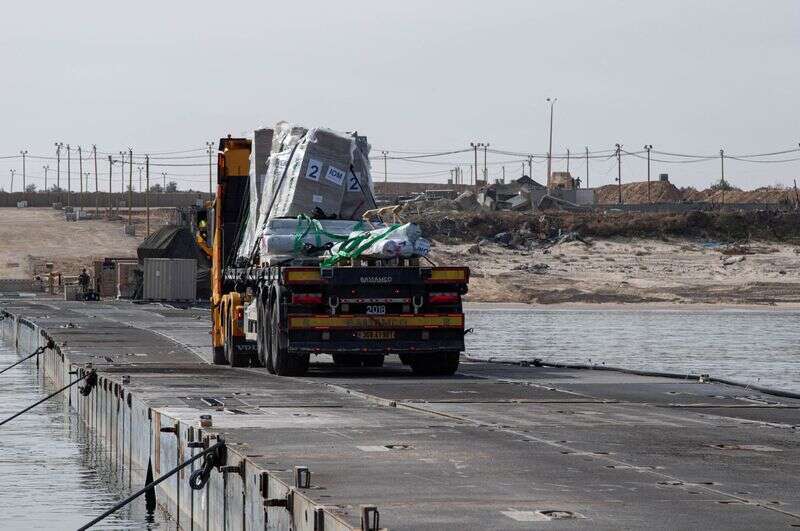 Gaza pier resumes operations as aid piles up