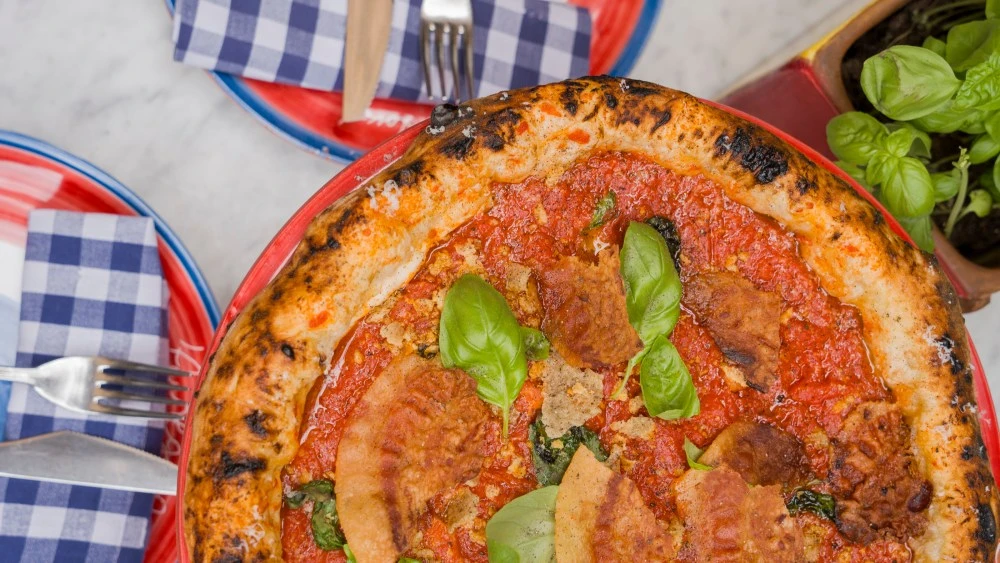 This Cult Pizzeria Backed by Remo Ruffini’s Archive Lands in Rome