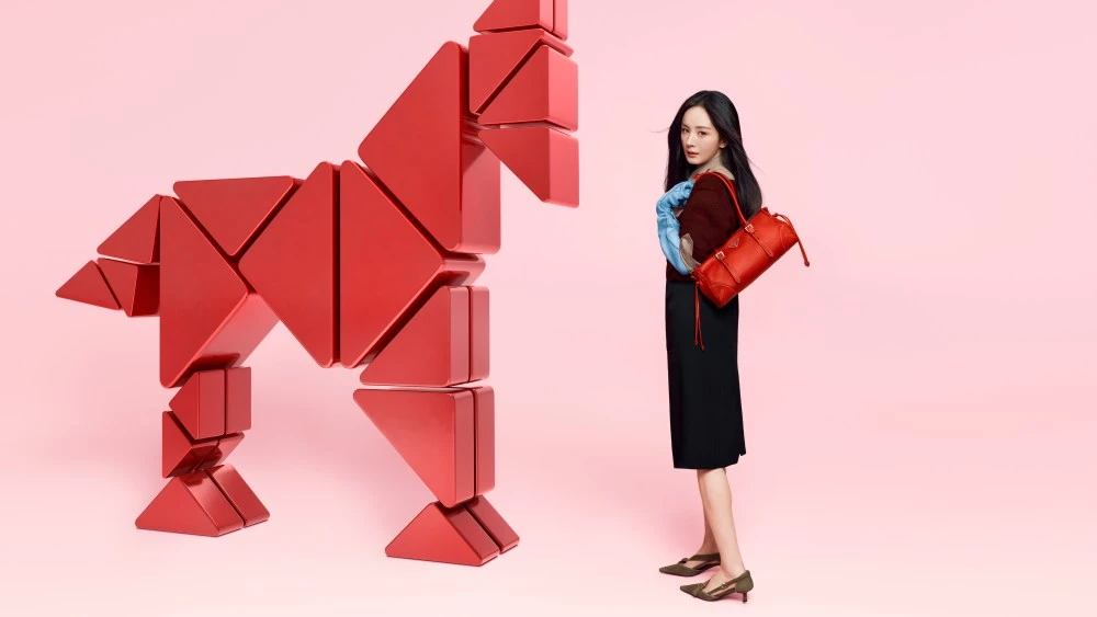 EXCLUSIVE: Prada Gallops Into Year of the Horse With Yang Mi, Ma Long