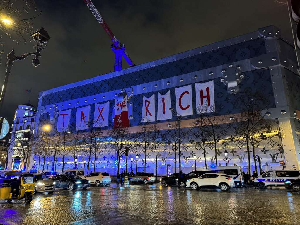 Activists Target Louis Vuitton Building on the Champs-Élysées