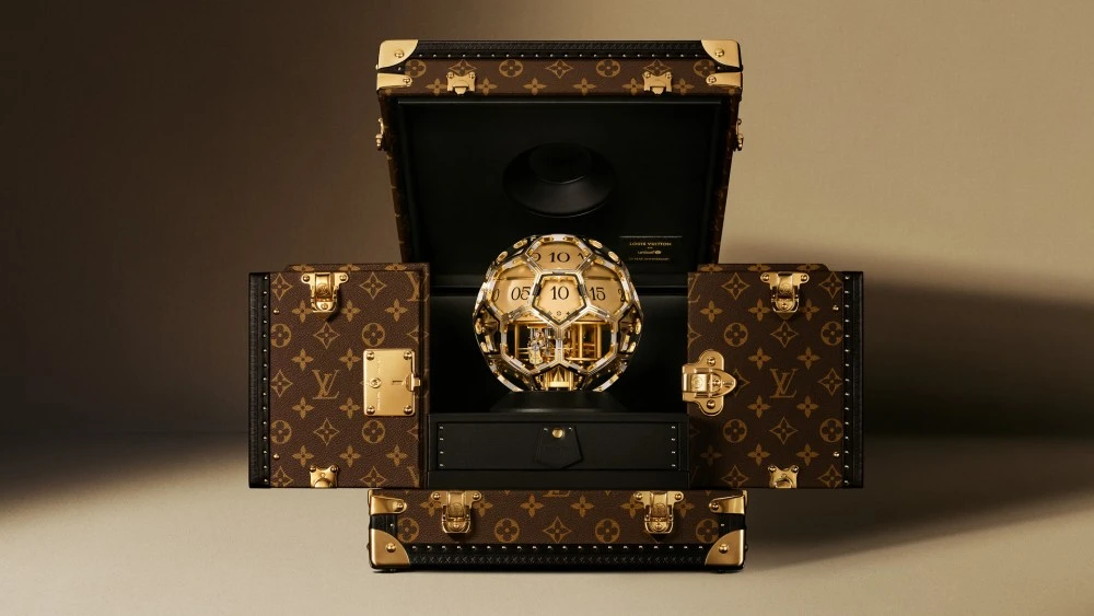 EXCLUSIVE: Louis Vuitton Marks 10 Years of UNICEF Partnership With a Clock Shaped Like a Soccer Ball