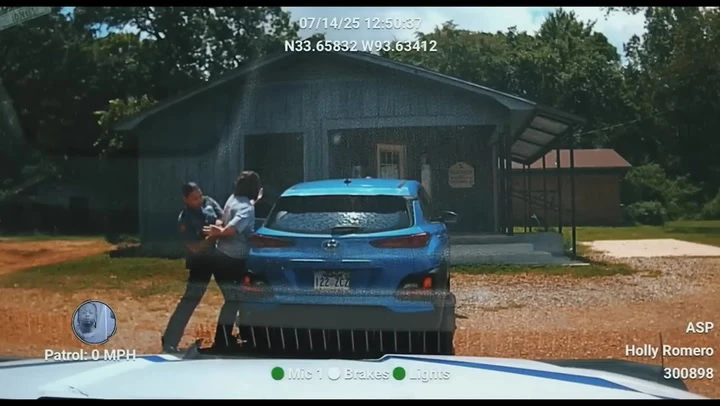 Watch: State trooper arrests woman rushing to save dying dog