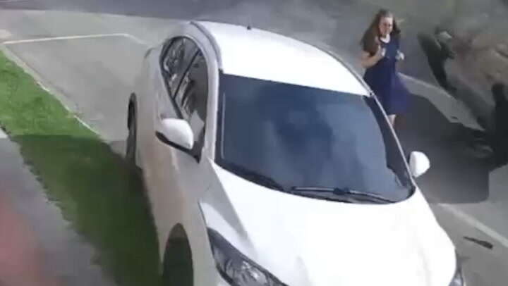 Miracle moment woman escapes being hit by flying car