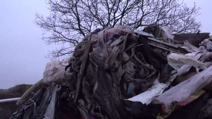 Drone footage shows mystery 40-foot rubbish mountain blocking UK road