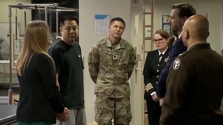 Vance jokes about job complaints while visiting Walter Reed patients