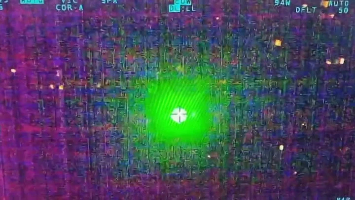 Dangerous moment laser targets police helicopter flying over city