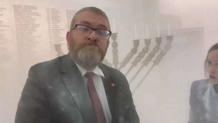 Far-right Polish MP douses Hanukkah candle with fire extinguisher