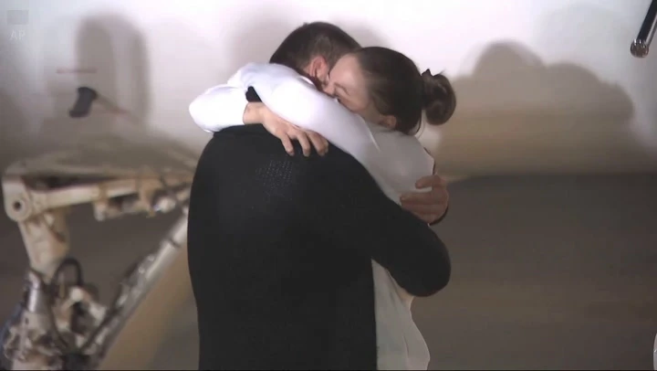 Ksenia Karelina embraces fiancé as she returns from Russian jail