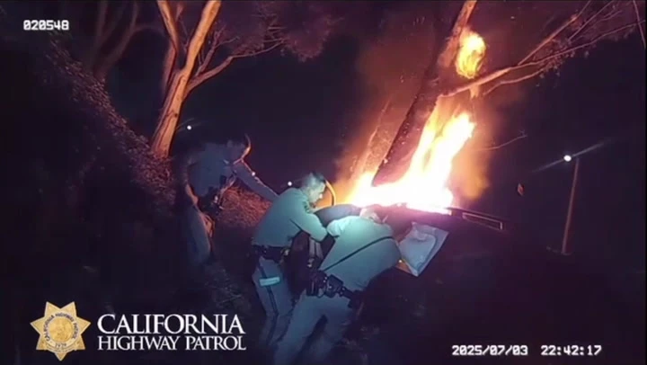 Driver pulled from burning car by California Highway Patrol officers