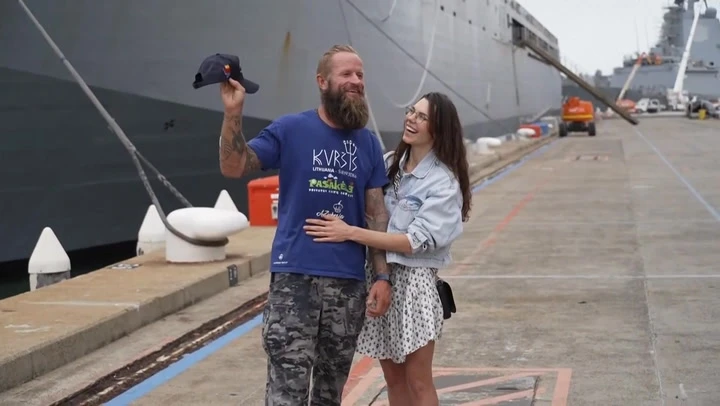 Rower trapped for three days in Cyclone Alfred reunited with wife