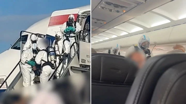 Moment hazmat crew boards BA plane after mid-flight ‘pandemonium’