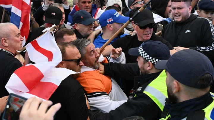 Police clash with anti-migrant protesters marching on Epping council