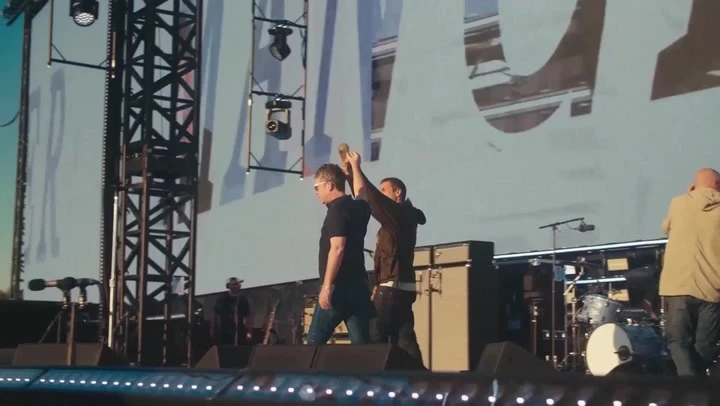 Gallagher brothers walk hand-in-hand to kick off Heaton Park concert