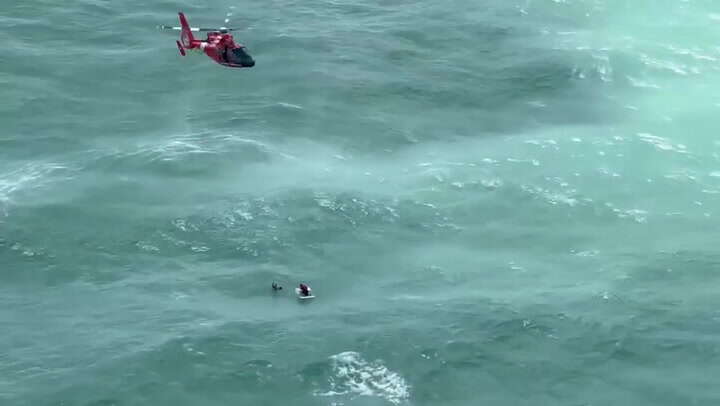 Hurricane Milton: Watch US Coast Guard rescue man clinging to ice box