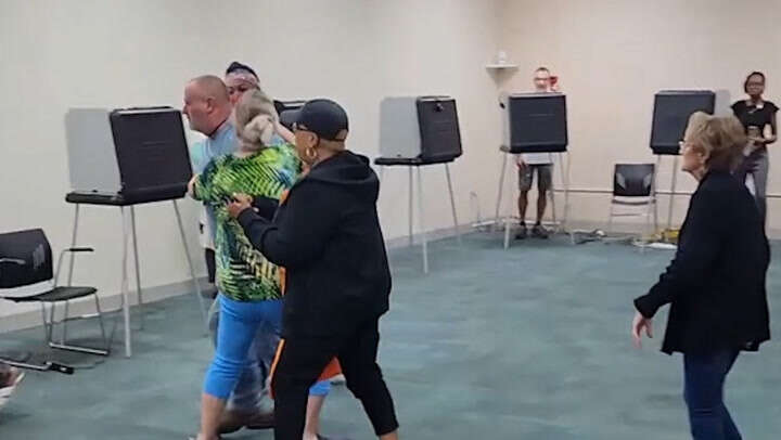 Video: Fight breaks out at voting site after voter told to remove hat