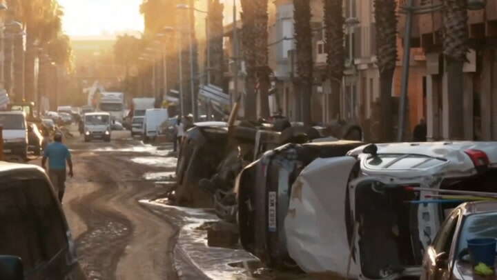 Cars and furniture lay piled up in mud as Spain reels from floods