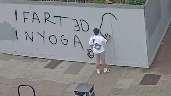 CCTV: Suspect sprays bizarre graffiti message on London wall