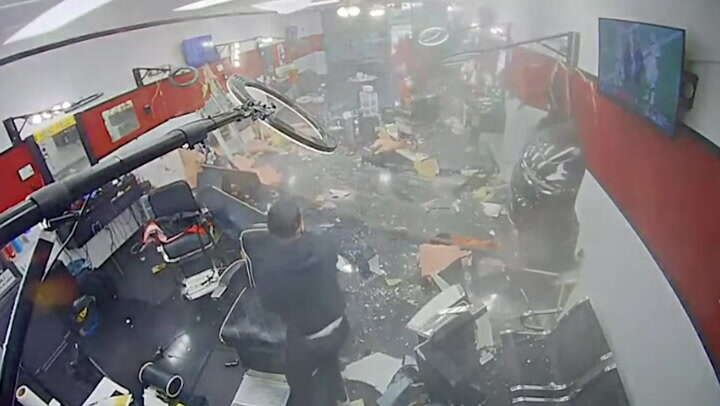 Video captures moment SUV slams into Houston barber shop