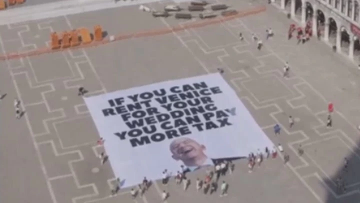 Protesters unfurl huge anti-Bezos banner in Venice ahead of wedding