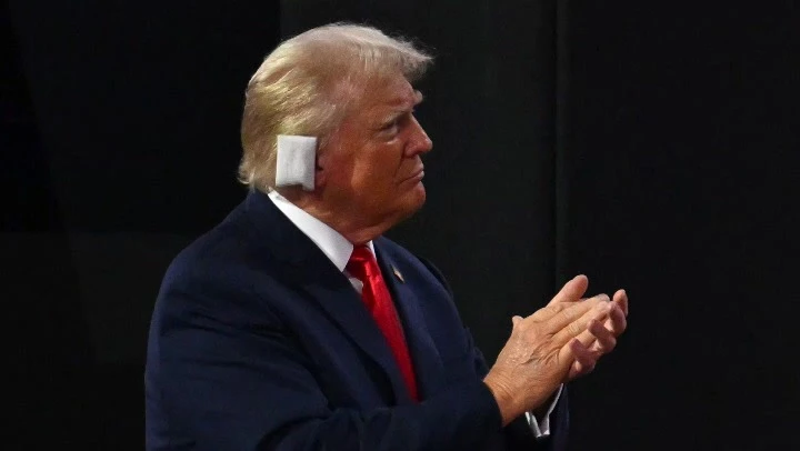 Trump appears emotional as he enters RNC with bandaged ear