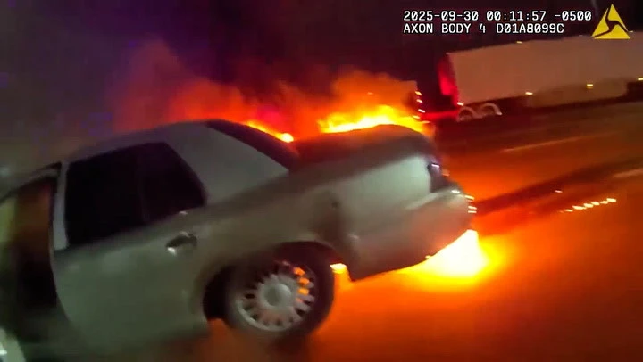 Hero cop pulls suspected drunk driver from burning car after a crash