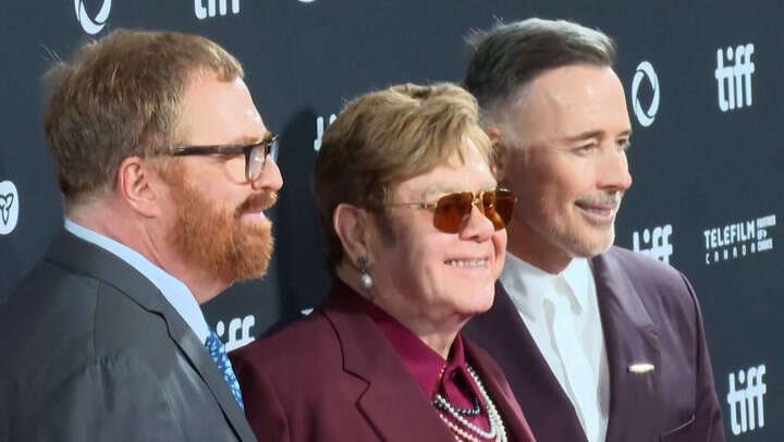 Elton John smiles in first public appearance since ‘severe infection’