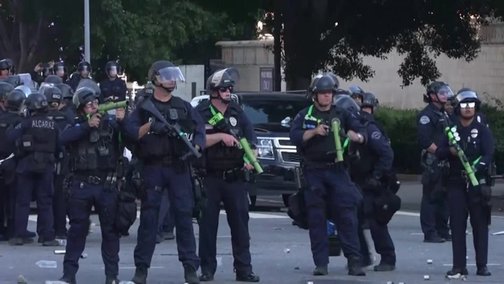 Police use tear gas and flash grenades to disperse LA protesters