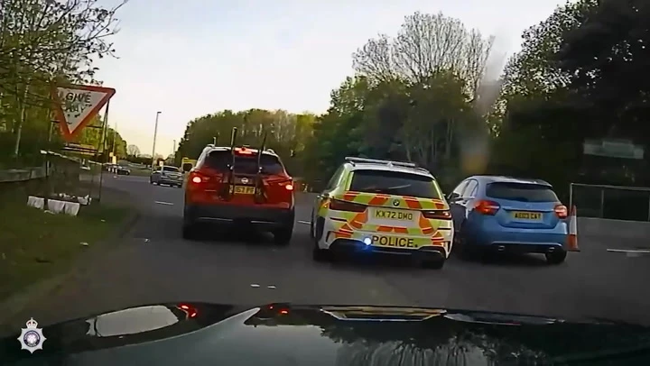 Mercedes crashes in garden following high speed police pursuit