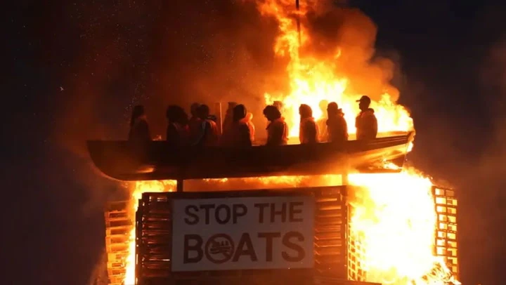 Life-size mannequins in migrant boat burn on Northern Ireland bonfire